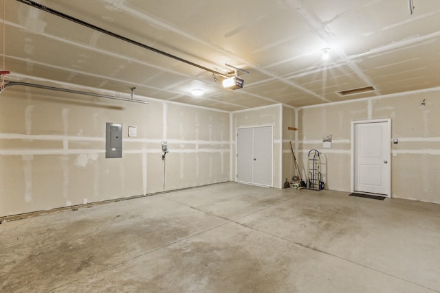 13202 N Addison St, Spokane, WA 99208 - garage featuring electric panel and a garage door opener