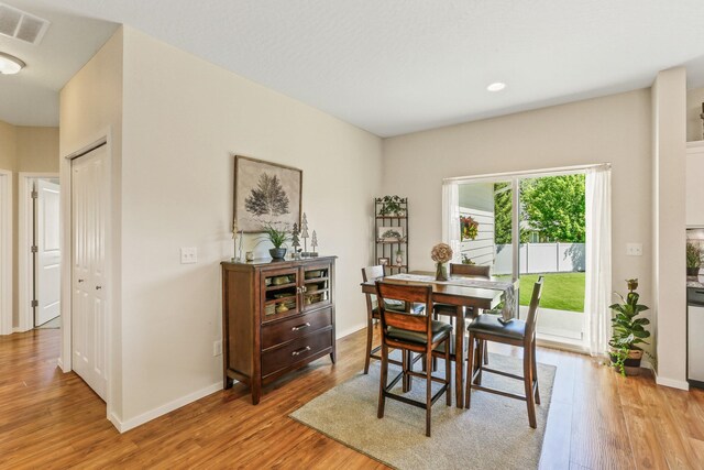 13202 N Addison St, Spokane, WA 99208 - dining room featuring light wood finished floors, baseboards, and recessed lighting