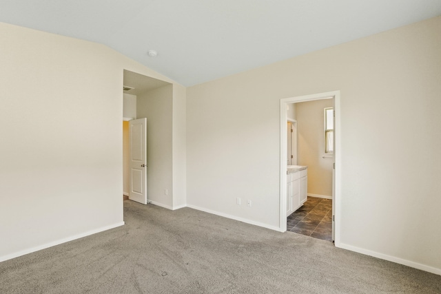 13202 N Addison St, Spokane, WA 99208 - spare room with dark carpet, lofted ceiling, and baseboards