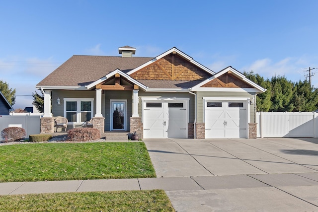 3260 W Magistrate Loop, Hayden, ID 83835 - craftsman inspired home with concrete driveway, a garage, a gate, and roof with shingles