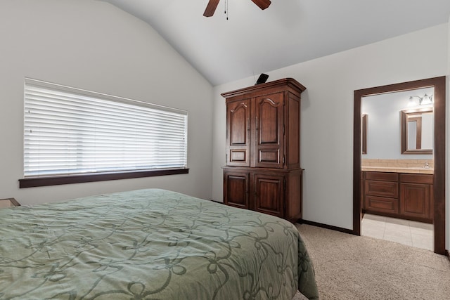 3260 W Magistrate Loop, Hayden, ID 83835 - bedroom featuring vaulted ceiling, light carpet, connected bathroom, and ceiling fan