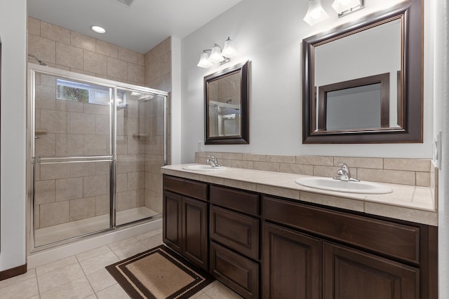 3260 W Magistrate Loop, Hayden, ID 83835 - bathroom featuring a shower stall, double vanity, and tile patterned floors