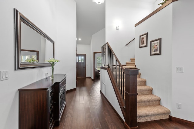 3260 W Magistrate Loop, Hayden, ID 83835 - staircase with high vaulted ceiling, wood finished floors, and baseboards