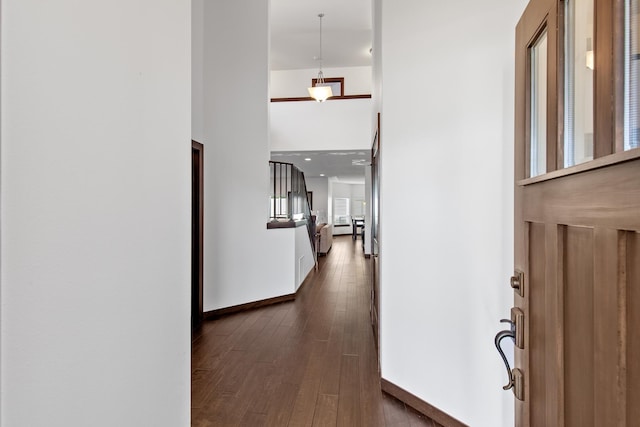 3260 W Magistrate Loop, Hayden, ID 83835 - hall with baseboards, dark wood-style flooring, and a high ceiling