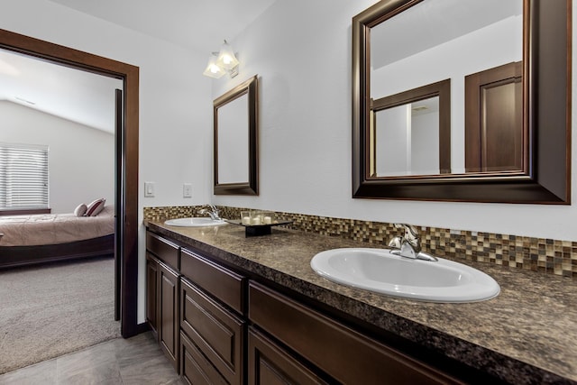 3260 W Magistrate Loop, Hayden, ID 83835 - full bathroom featuring connected bathroom, double vanity, and vaulted ceiling