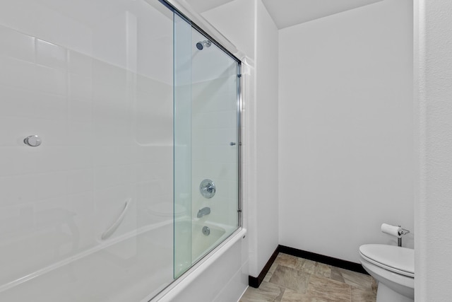 3260 W Magistrate Loop, Hayden, ID 83835 - bathroom featuring baseboards, shower / bath combination with glass door, and toilet