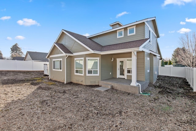 3260 W Magistrate Loop, Hayden, ID 83835 - rear view of property with a fenced backyard and roof with shingles