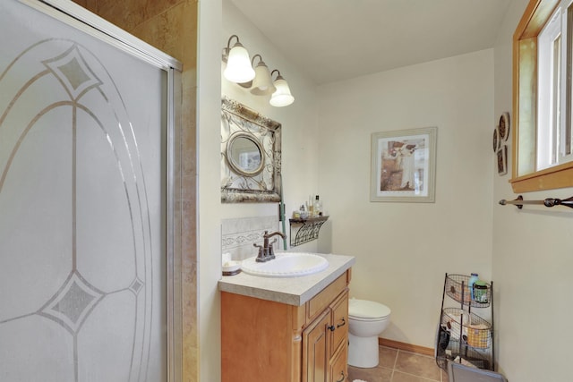 11307 E 8th Ave, Spokane Valley, WA 99206 - full bathroom with toilet, vanity, tile patterned flooring, and a shower