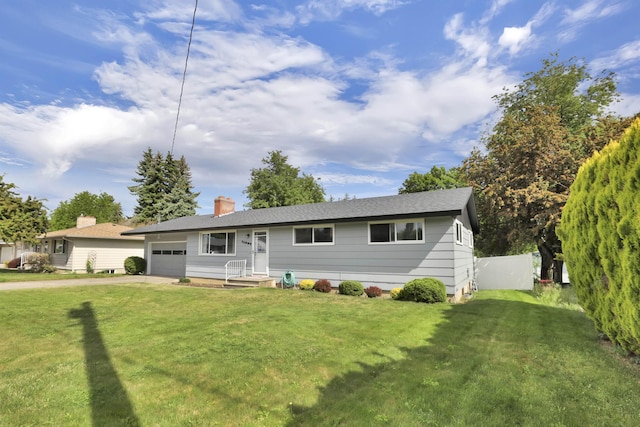 11307 E 8th Ave, Spokane Valley, WA 99206 - ranch-style home with a garage, concrete driveway, and a chimney
