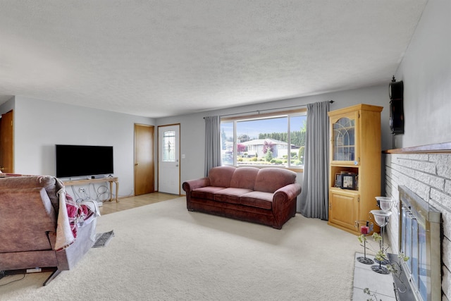 11307 E 8th Ave, Spokane Valley, WA 99206 - living area with light carpet, a fireplace, and a textured ceiling