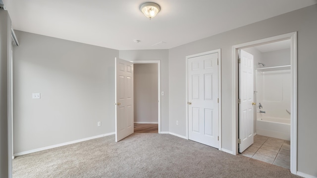 12218 W 10th Ave, Airway Heights, WA 99001 - unfurnished bedroom with carpet floors, baseboards, and connected bathroom