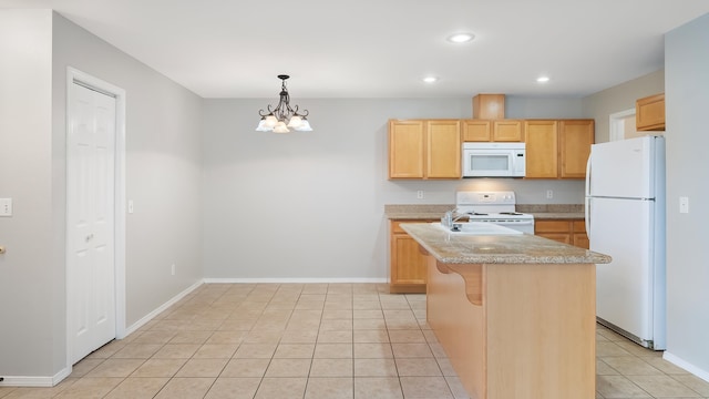 12218 W 10th Ave, Airway Heights, WA 99001 - kitchen with white appliances, light brown cabinetry, light countertops, recessed lighting, and baseboards