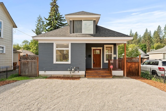 2018 E 6th Ave, Spokane, WA 99202 - view of front facade featuring roof with shingles, a porch, and gravel driveway