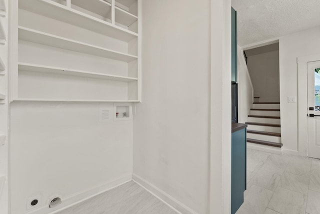 2018 E 6th Ave, Spokane, WA 99202 - washroom with electric dryer hookup, baseboards, hookup for a washing machine, marble finish floors, and a textured ceiling