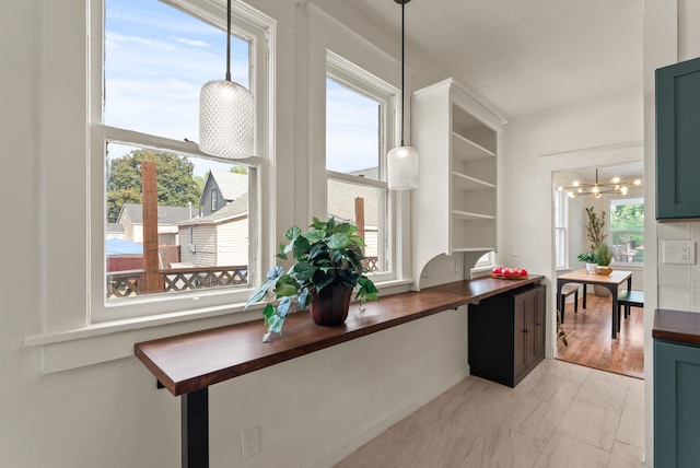 2018 E 6th Ave, Spokane, WA 99202 - kitchen featuring butcher block counters, light marble finish floors, open shelves, and a chandelier