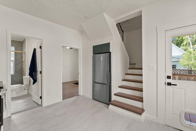 2018 E 6th Ave, Spokane, WA 99202 - stairs featuring baseboards and a textured ceiling