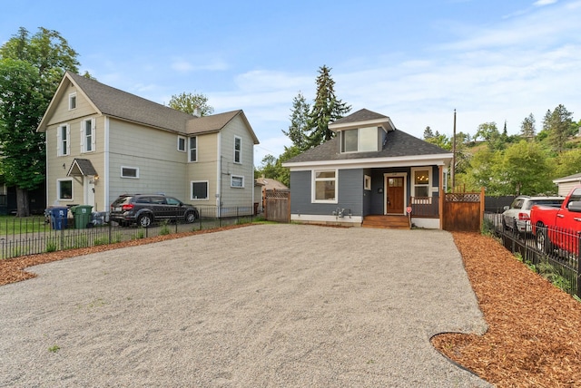 2018 E 6th Ave, Spokane, WA 99202 - view of front of house with covered porch, driveway, and roof with shingles