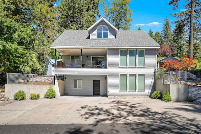 12916 N Newman St, Newman Lake, WA 99025 - view of front of home featuring a shingled roof, concrete driveway, and a balcony