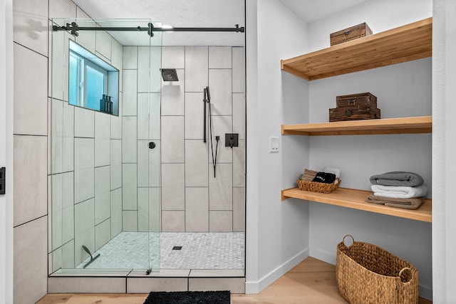 12916 N Newman St, Newman Lake, WA 99025 - bathroom featuring a shower stall, wood finished floors, and baseboards