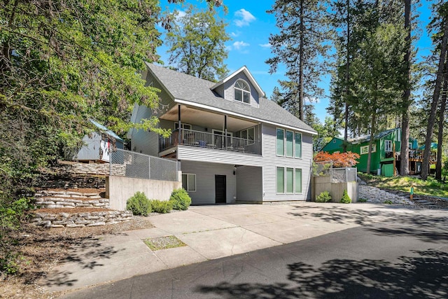 12916 N Newman St, Newman Lake, WA 99025 - view of front facade featuring a balcony and roof with shingles