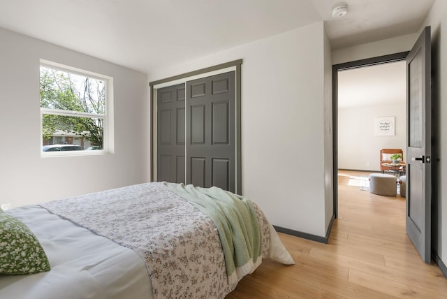 1509 N Lee St, Spokane, WA 99207 - bedroom with light wood-style flooring, a closet, and baseboards