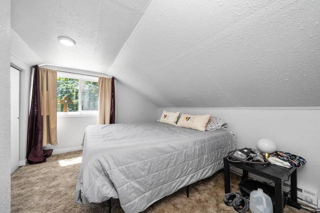 1503 E Dalton Ave, Spokane, WA 99207 - carpeted bedroom featuring a textured ceiling, vaulted ceiling, and a baseboard heating unit