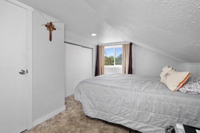 1503 E Dalton Ave, Spokane, WA 99207 - bedroom with a textured ceiling, carpet floors, lofted ceiling, and baseboards