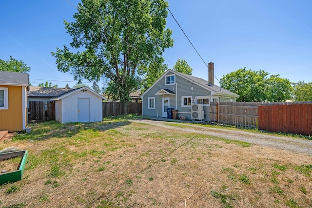 1503 E Dalton Ave, Spokane, WA 99207 - rear view of house featuring a chimney and a cooling unit