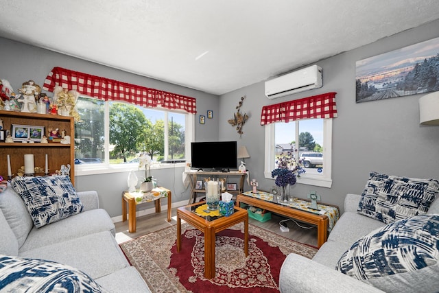 1503 E Dalton Ave, Spokane, WA 99207 - living room with a wall mounted AC, wood finished floors, and baseboards
