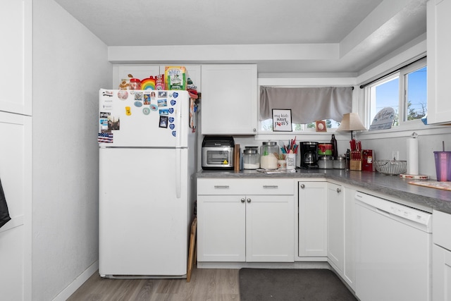 1503 E Dalton Ave, Spokane, WA 99207 - kitchen with white appliances, light wood-style floors, white cabinetry, and baseboards