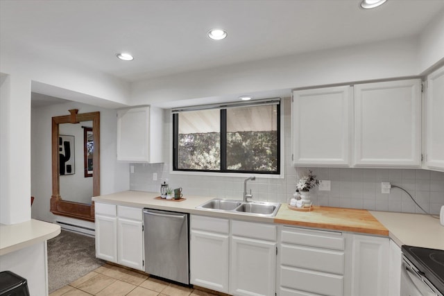 1002 W 7th Ave Unit 301, Spokane, WA 99204 - kitchen featuring dishwasher, a sink, decorative backsplash, light countertops, and white cabinetry