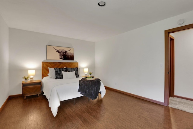 1002 W 7th Ave Unit 301, Spokane, WA 99204 - bedroom featuring baseboards and wood finished floors