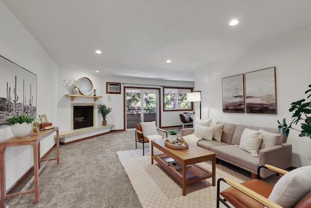 1002 W 7th Ave Unit 301, Spokane, WA 99204 - carpeted living room featuring recessed lighting, a fireplace with raised hearth, and baseboards