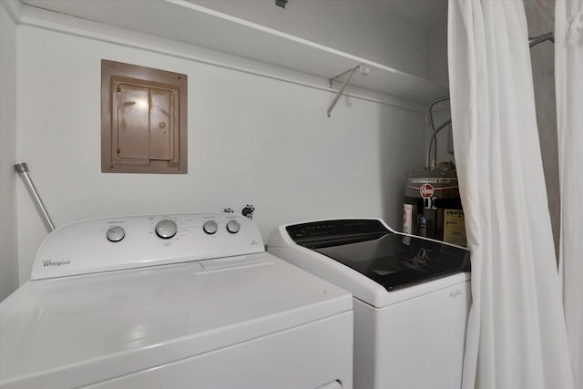 1002 W 7th Ave Unit 301, Spokane, WA 99204 - washroom featuring independent washer and dryer, electric panel, and electric water heater