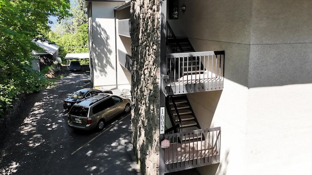 1002 W 7th Ave Unit 301, Spokane, WA 99204 - view of property exterior with stairs and stucco siding