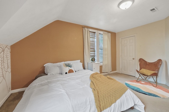 703 E Montgomery Ave, Spokane, WA 99207 - bedroom featuring light carpet, baseboards, and vaulted ceiling