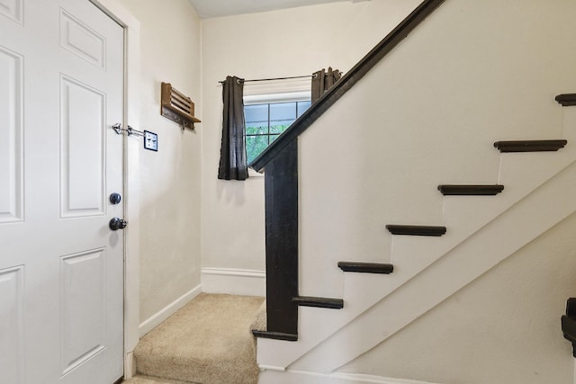 703 E Montgomery Ave, Spokane, WA 99207 - stairway featuring baseboards and carpet floors