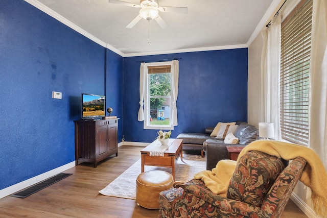703 E Montgomery Ave, Spokane, WA 99207 - living area featuring wood finished floors, ceiling fan, ornamental molding, and baseboards