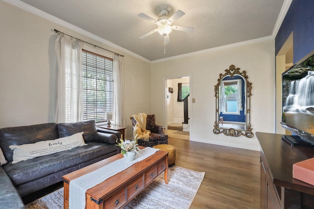 703 E Montgomery Ave, Spokane, WA 99207 - living room with wood finished floors, crown molding, a ceiling fan, and baseboards