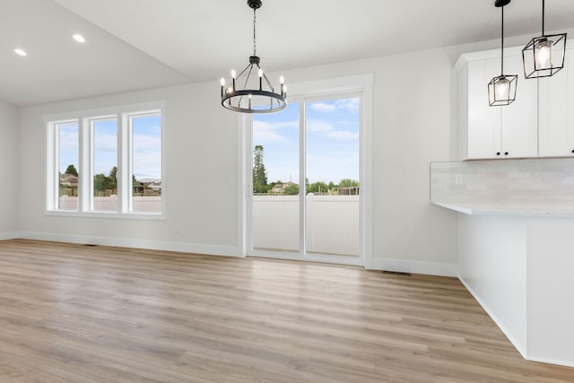 1817 N Arties Rd, Spokane Valley, WA 99016 - unfurnished dining area with a chandelier, healthy amount of natural light, baseboards, and recessed lighting