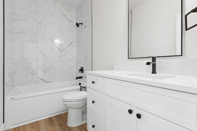 1817 N Arties Rd, Spokane Valley, WA 99016 - bathroom featuring vanity, toilet, bathing tub / shower combination, and wood finished floors