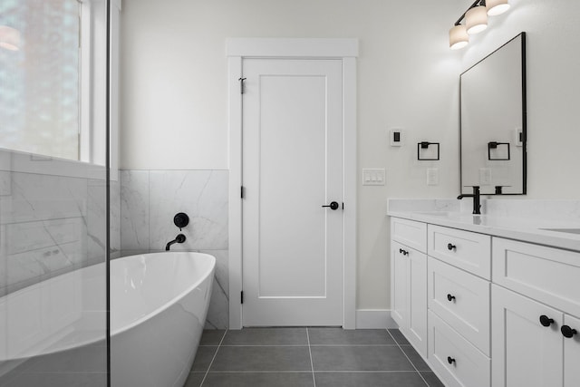 1817 N Arties Rd, Spokane Valley, WA 99016 - full bathroom with a freestanding tub, double vanity, tile patterned flooring, and tile walls