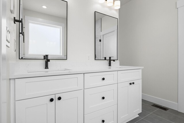 1817 N Arties Rd, Spokane Valley, WA 99016 - full bathroom with double vanity, tile patterned flooring, and baseboards