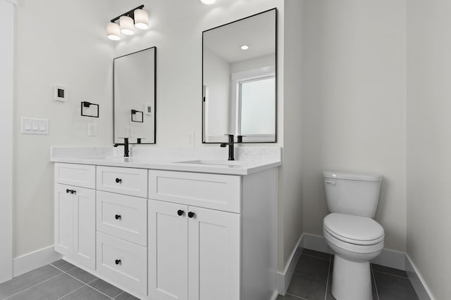 1817 N Arties Rd, Spokane Valley, WA 99016 - full bath featuring baseboards, tile patterned floors, toilet, and double vanity