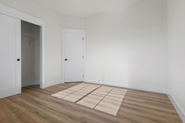 1817 N Arties Rd, Spokane Valley, WA 99016 - unfurnished bedroom with wood finished floors, baseboards, and a closet