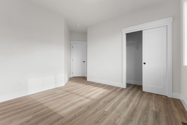 1817 N Arties Rd, Spokane Valley, WA 99016 - unfurnished bedroom with wood finished floors, baseboards, and a closet