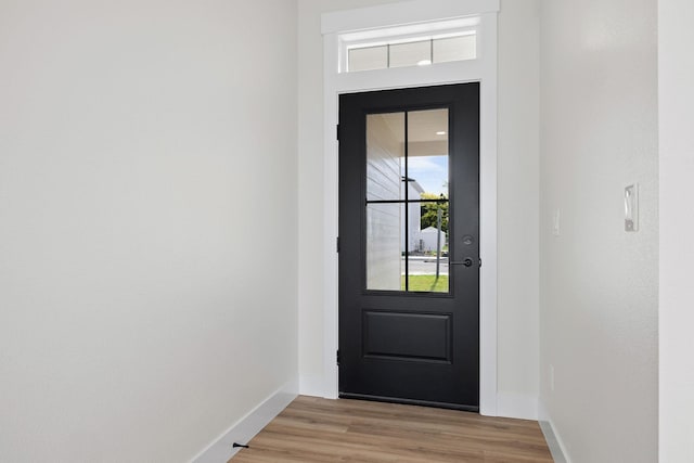 1817 N Arties Rd, Spokane Valley, WA 99016 - doorway to outside featuring baseboards and light wood-style flooring