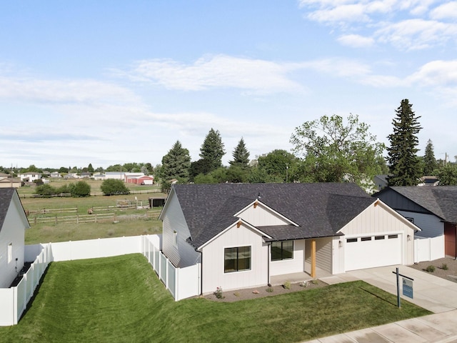 1817 N Arties Rd, Spokane Valley, WA 99016 - modern inspired farmhouse with roof with shingles, an attached garage, driveway, and board and batten siding