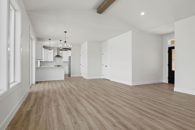 1817 N Arties Rd, Spokane Valley, WA 99016 - unfurnished living room featuring light wood-style floors, a chandelier, recessed lighting, and baseboards