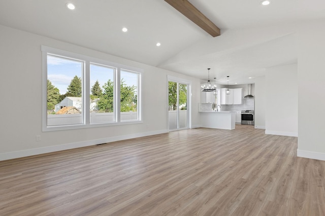1817 N Arties Rd, Spokane Valley, WA 99016 - unfurnished living room featuring recessed lighting, a chandelier, light wood-style floors, and baseboards